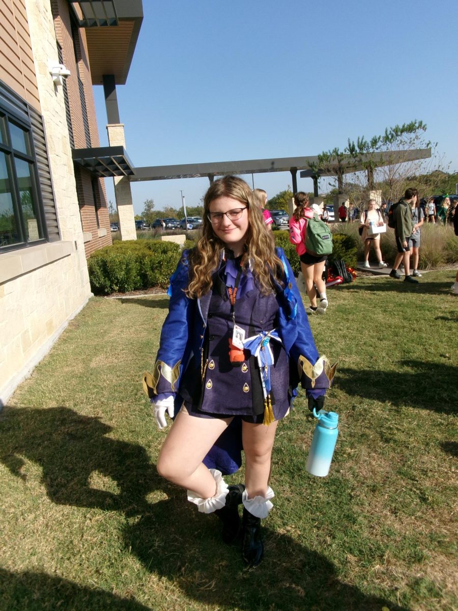 Game On! Kinley Haskins, 8, wears her Halloween costume to school on Oct. 31. for the final day of Red Ribbon Week. Haskins dressed as Furina from the video game “Genshin Impact”. “I thought it would be fun to dress up,” Haskins said.