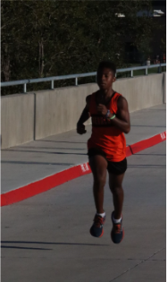 Run Like The Wind! Maddox Murry (8th) runs at a cross country meet on September 25. He ran his hardest, and just locked in, just like at every meet. “My brain just stops and my body just operates itself and somehow navigates [itself] like autopilot,” Murry said.