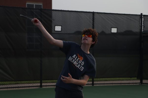 Smashing it on the court! Adam Ashby serves a ball to his opponent at one of his many tennis matches. Adam has won several tennis matches this year, but has taken his losses well. "When I win, it feels great, because I know all of the hard work I put in to get there." Adam states.