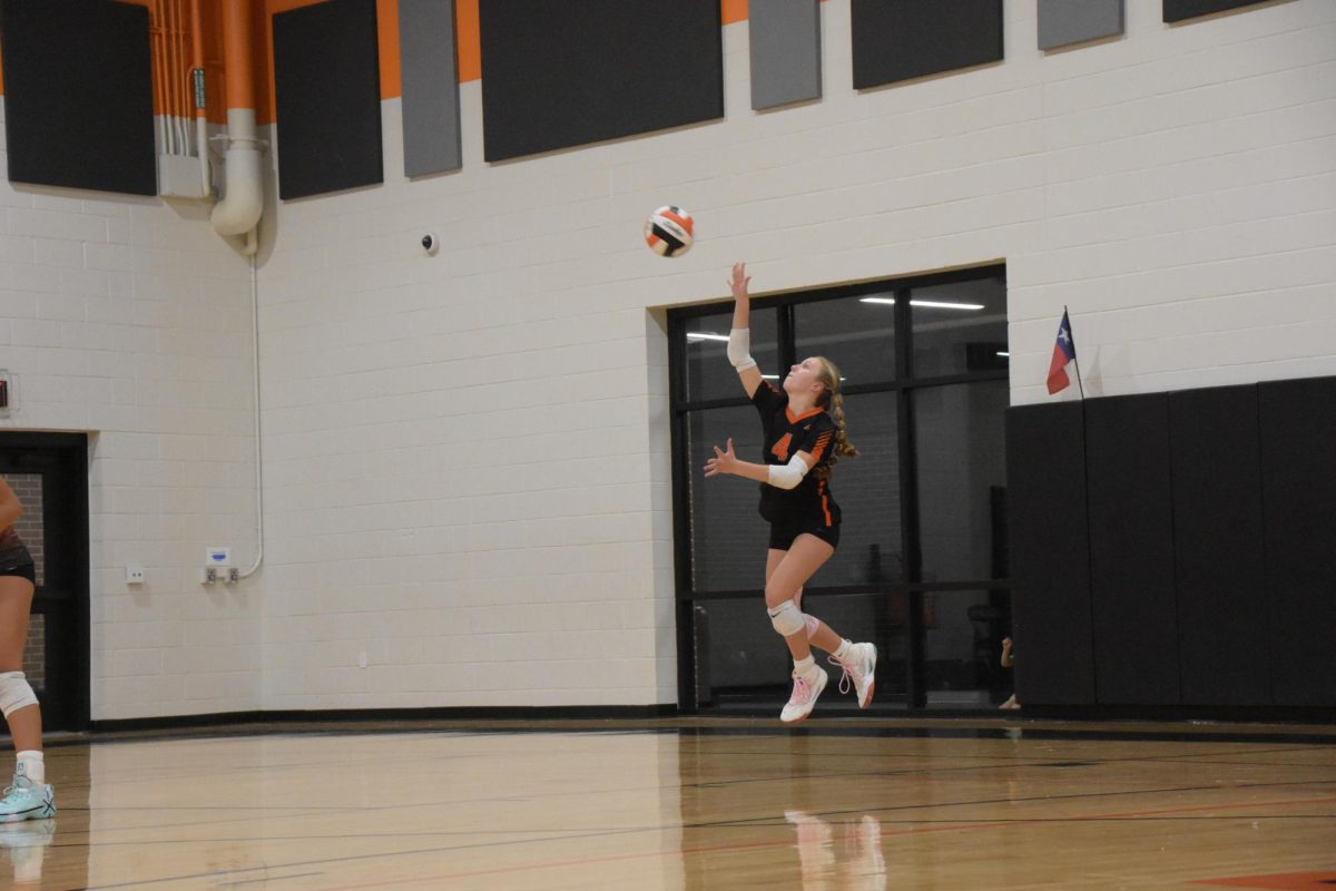 Aw... Ace! On September 4, our volleyball teams played against Burleson Hughes. A-Team Libero, number 4, Avery Manuel jumps to hit her serve, hoping to ace Hughes' back row. 