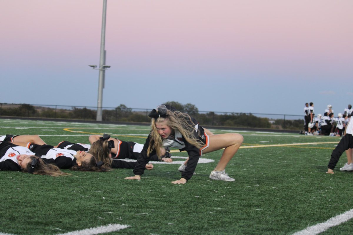 7th grader Grace Hightower does a backbend with a twist for the cheer teams Halloween Halftime. Grace said, "I had a lot of fun!"