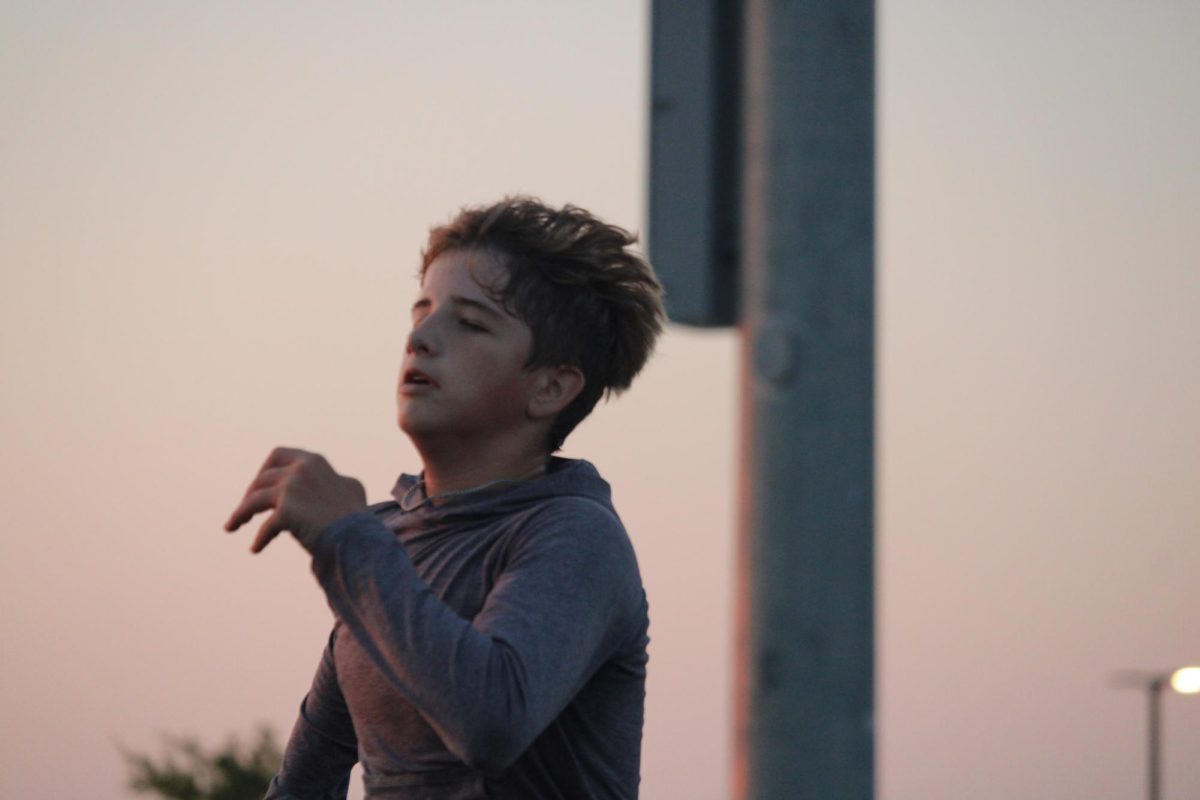 8th grader, Nelson Black, at the Cross Country. He said he was "running hard" and sad to see the season go, but he's excited to do Cross country in high school.