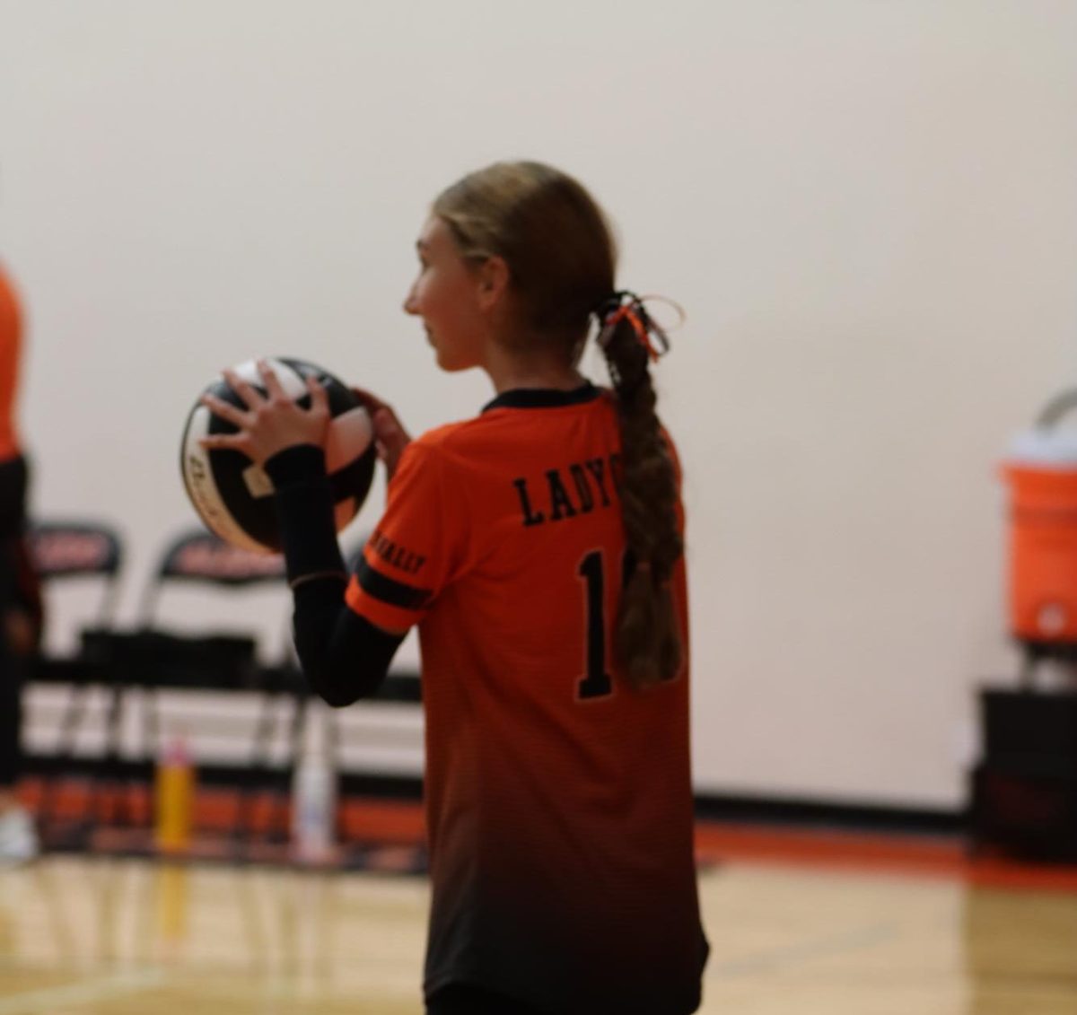 Aw Ace! Camille Cremer readies herself to serve against AMS' B-Team. Cremer knows that this point could determine who wins the game, and she starts her serving routine. 